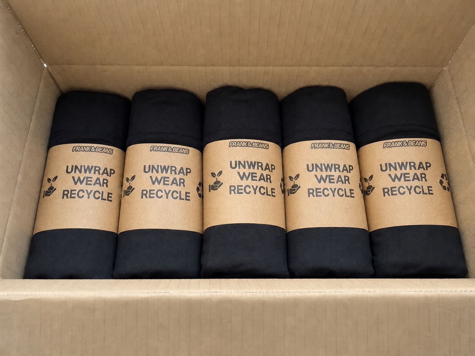 Frank and Beans underwear packs in recyclable cardboard sleeves inside a shipping carton